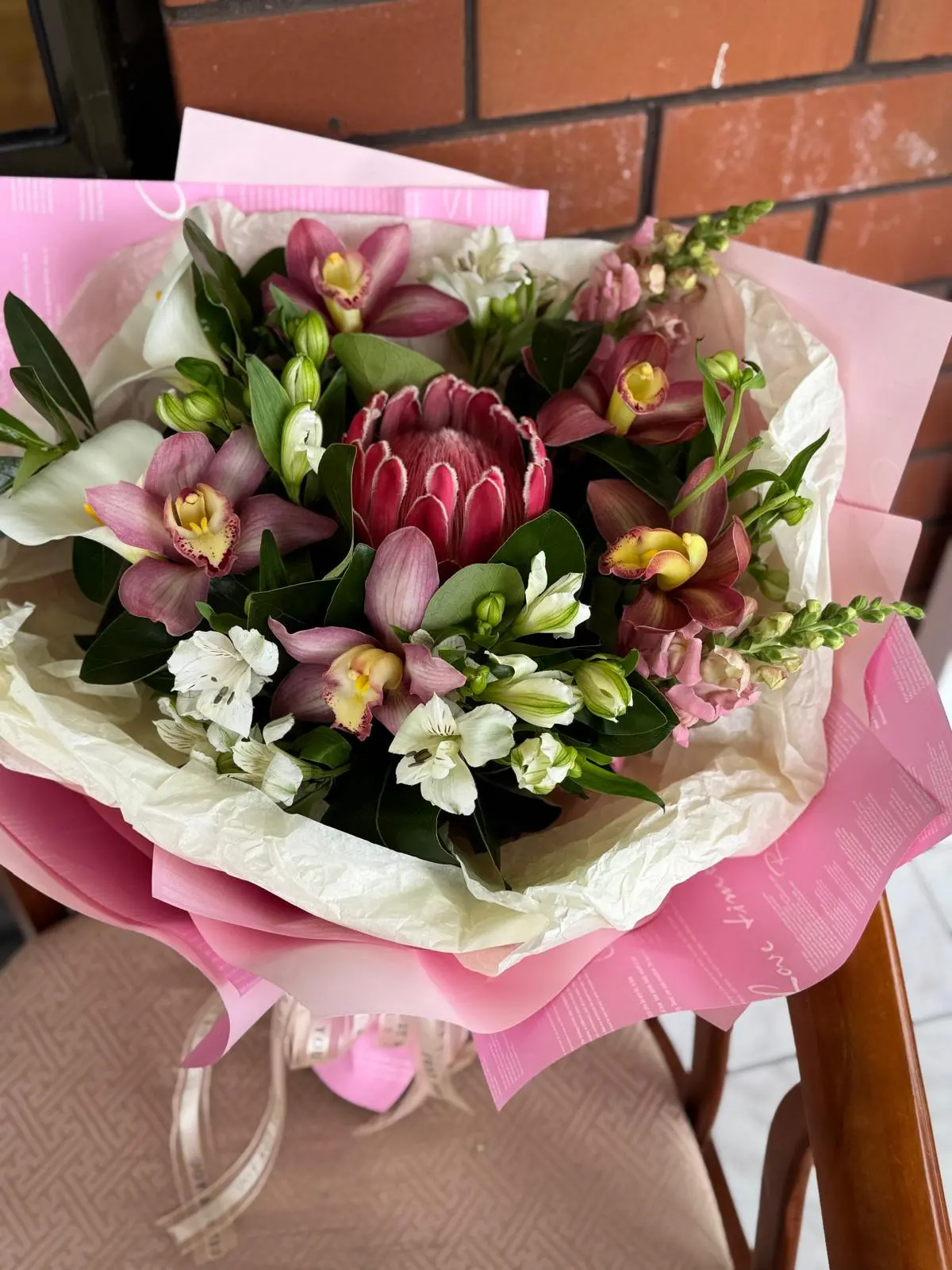 pink protea & orchid bouquet