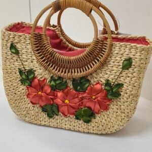 Natural woven handmade eco bag with red floral decoration and round rattan handles