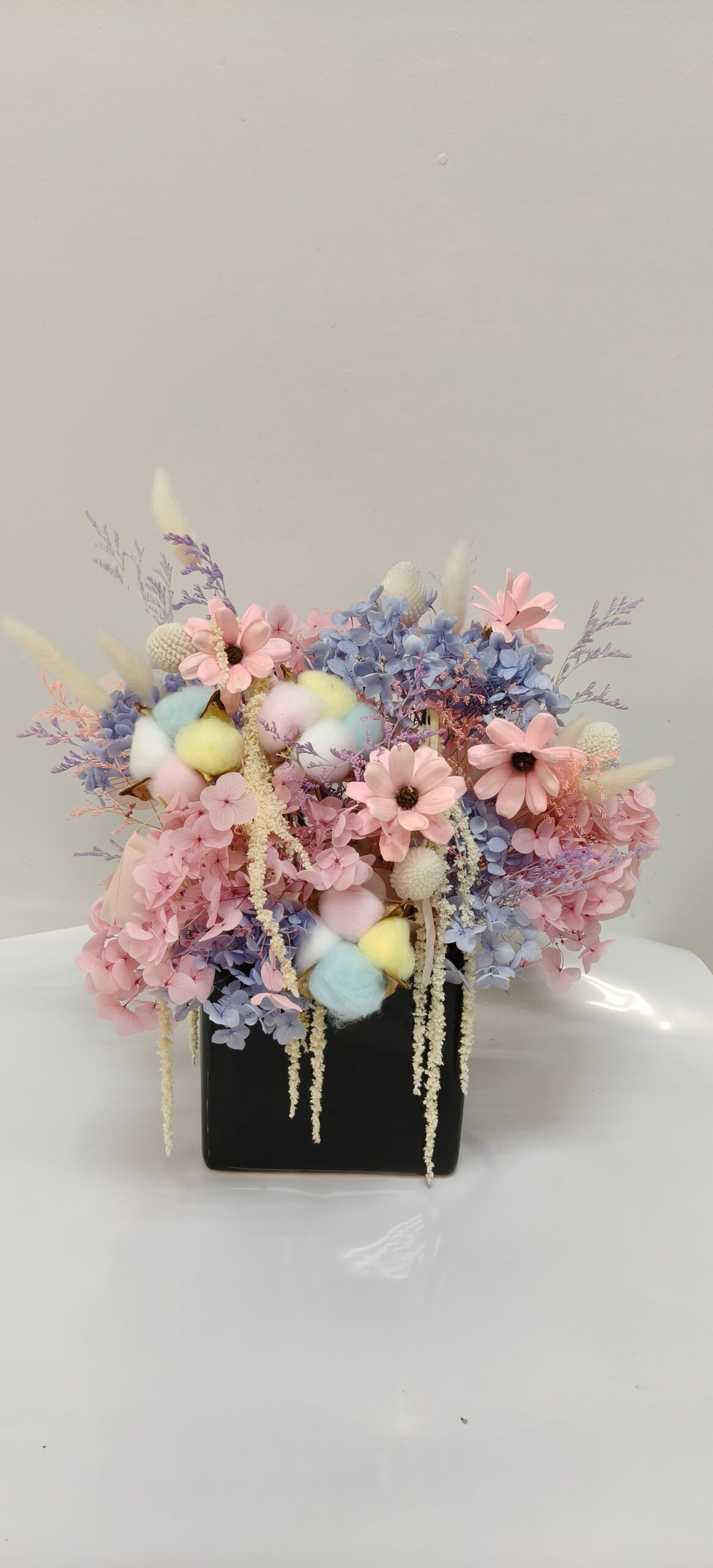 Pastel dried flower arrangement with pink and blue hydrangea