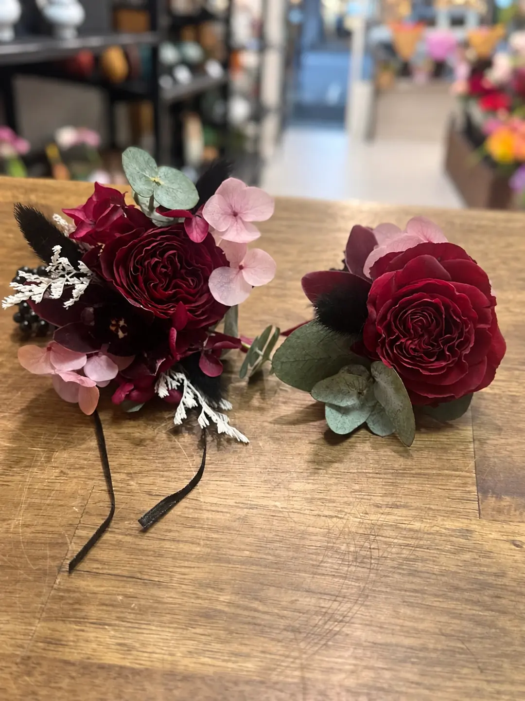 Burgundy & Pink wrist corsage and matching boutonniere set by Camellia & Co Auckland
