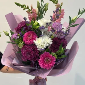 Purple and white bouquet with chrysanthemums, roses and delicate filler flowers