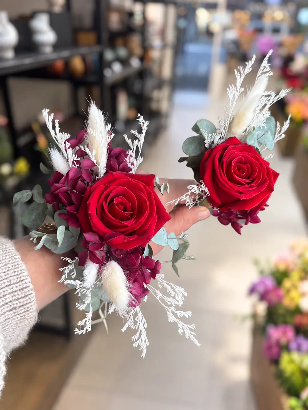 Red & White wrist corsage and matching boutonniere set by Camellia & Co Auckland