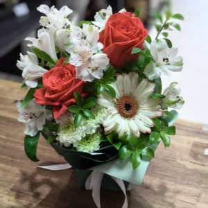 Bouquet of red roses, white alstroemeria, white gerbera and greenery